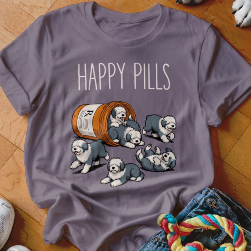 Purple t-shirt with "Happy Pills" text and cartoon Old English Sheepdog puppies spilling from a bottle.