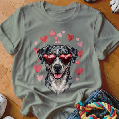 Sage green crewneck t-shirt featuring a printed graphic of a spotted dog wearing heart-shaped sunglasses, surrounded by pink hearts.