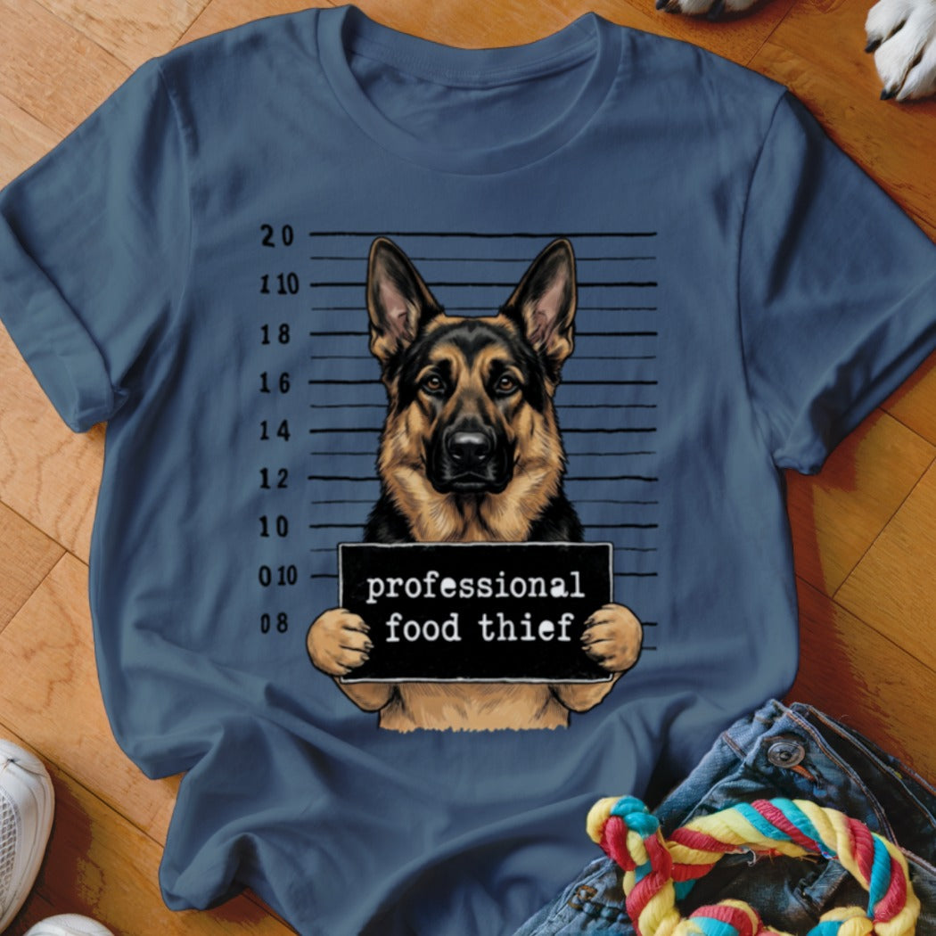 German Shepherd mugshot with sign reading "professional food thief"