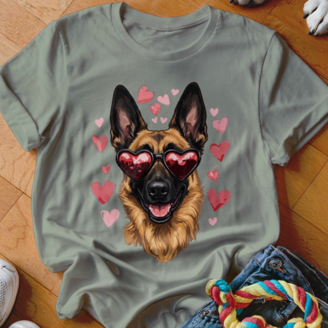 Sage green t-shirt featuring a graphic of a German Shepherd wearing heart-shaped sunglasses surrounded by pink hearts.
