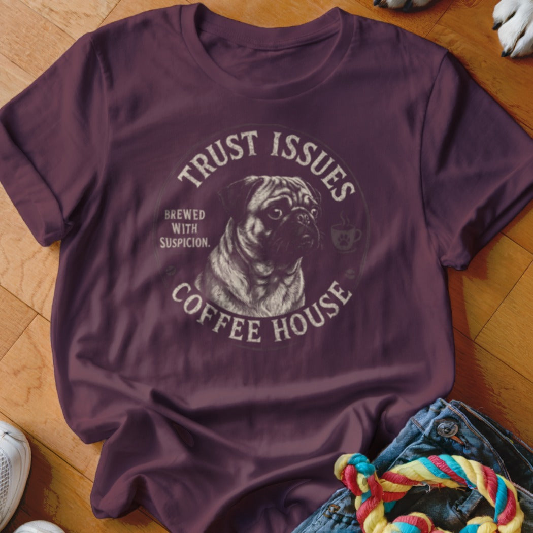 Maroon t-shirt with a pug illustration and text that reads "Trust Issues Coffee House".