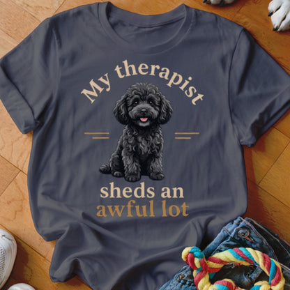 Dark grey t-shirt with a black poodle illustration and text "My therapist sheds an awful lot."