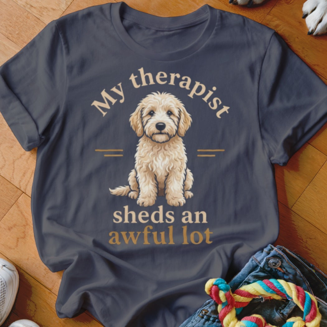 Dark gray t-shirt with a goldendoodle and text "My therapist sheds an awful lot".