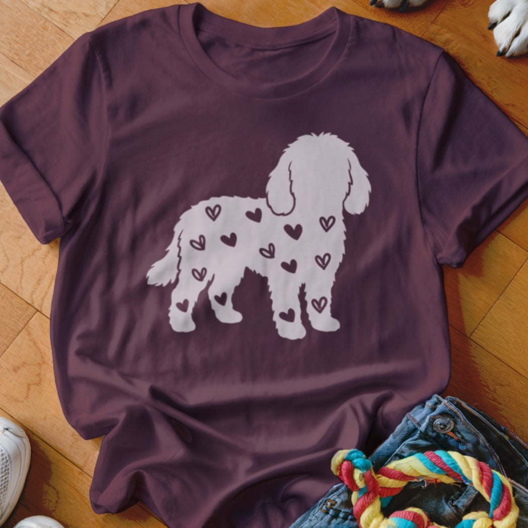 Maroon t-shirt with white dog silhouette filled with small hearts.