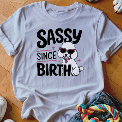 White t-shirt with "SASSY SINCE BIRTH" text and a poodle wearing sunglasses.