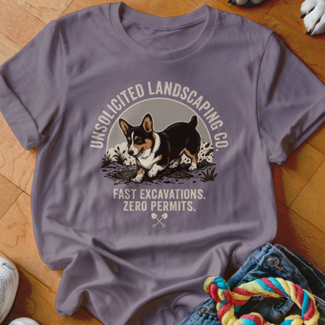 T-shirt graphic of a corgi digging with text "Unsolicited Landscaping Co." and "Fast Excavations. Zero Permits."