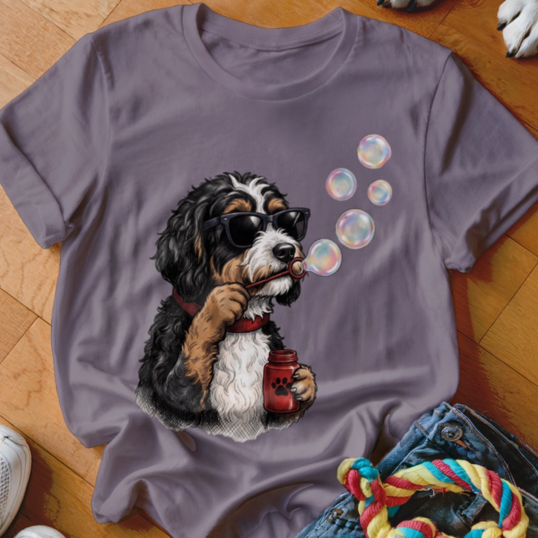 Grey crewneck t-shirt featuring a graphic of a Bernedoodle wearing sunglasses and blowing soap bubbles.