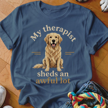 Blue t-shirt with golden retriever graphic and text "My therapist sheds an awful lot."