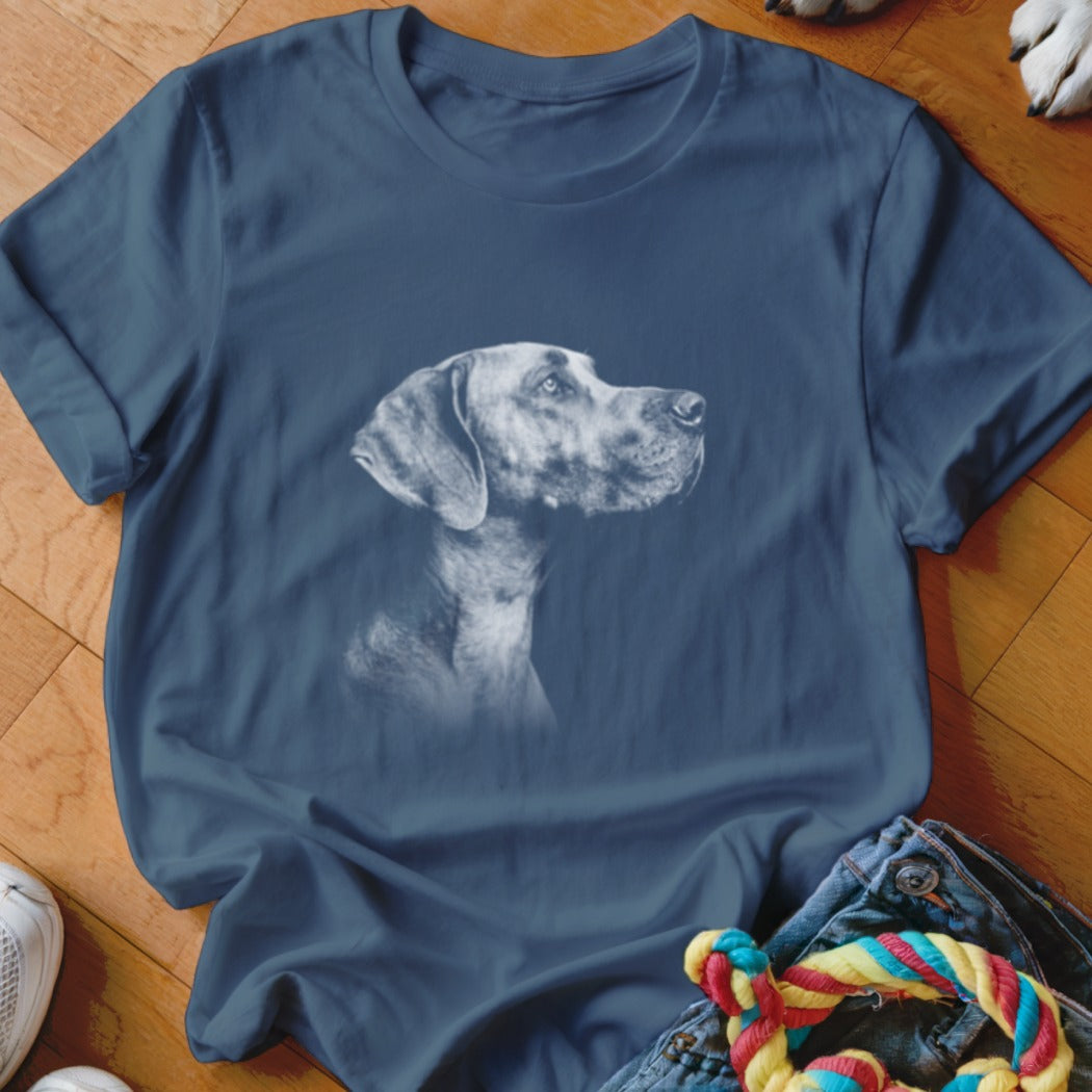 Blue t-shirt with a white outline sketch of a Weimaraner dog.