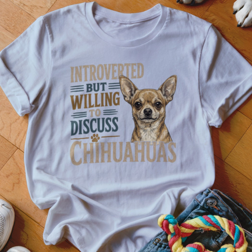 White t-shirt with a Chihuahua graphic and text: "Introverted but willing to discuss Chihuahuas."