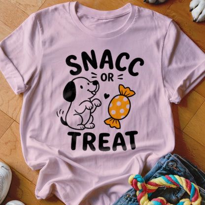 Pink t-shirt with "SNACC OR TREAT" text and cartoon dog with candy illustration.
