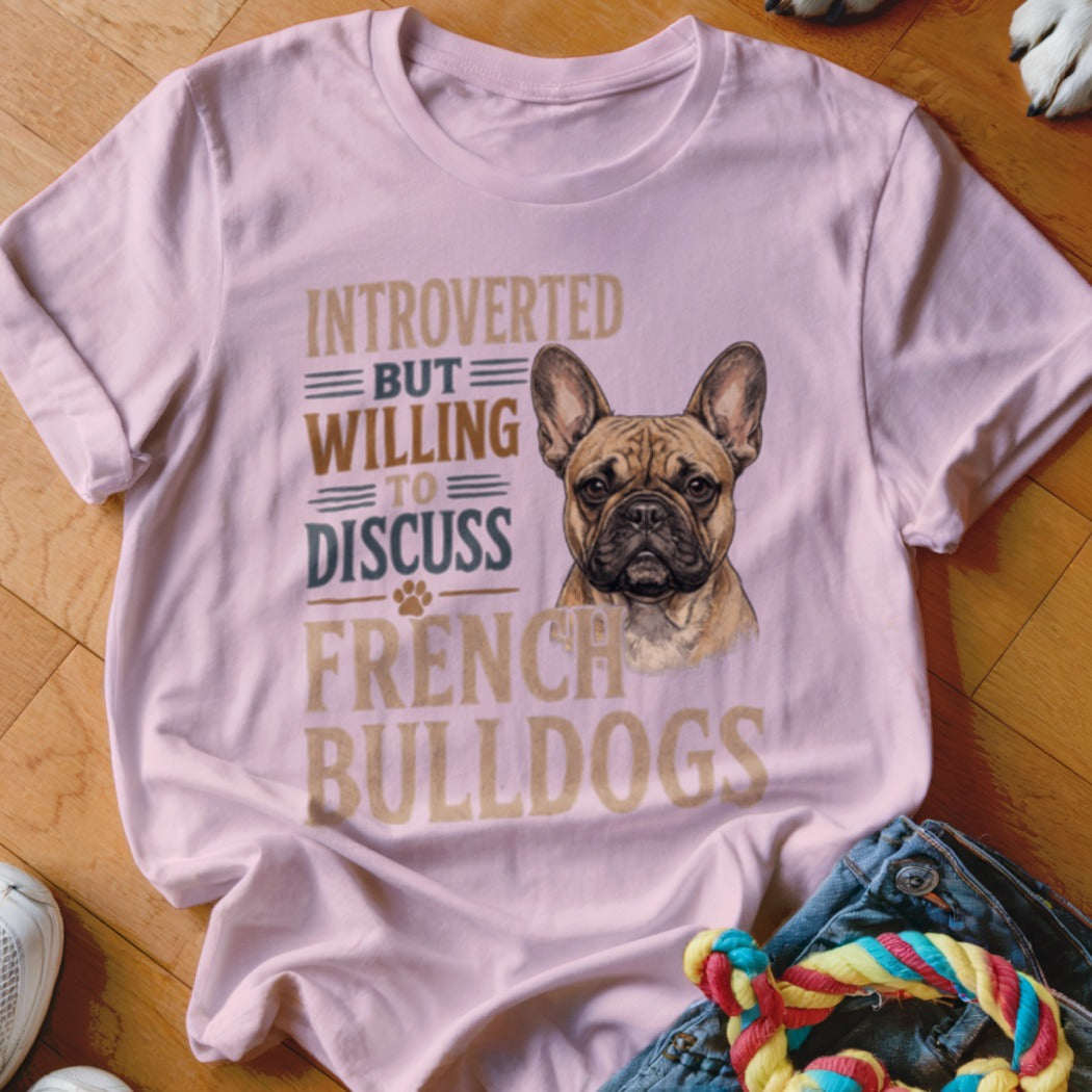 Light pink t-shirt with French bulldog and text "Introverted but willing to discuss French Bulldogs".