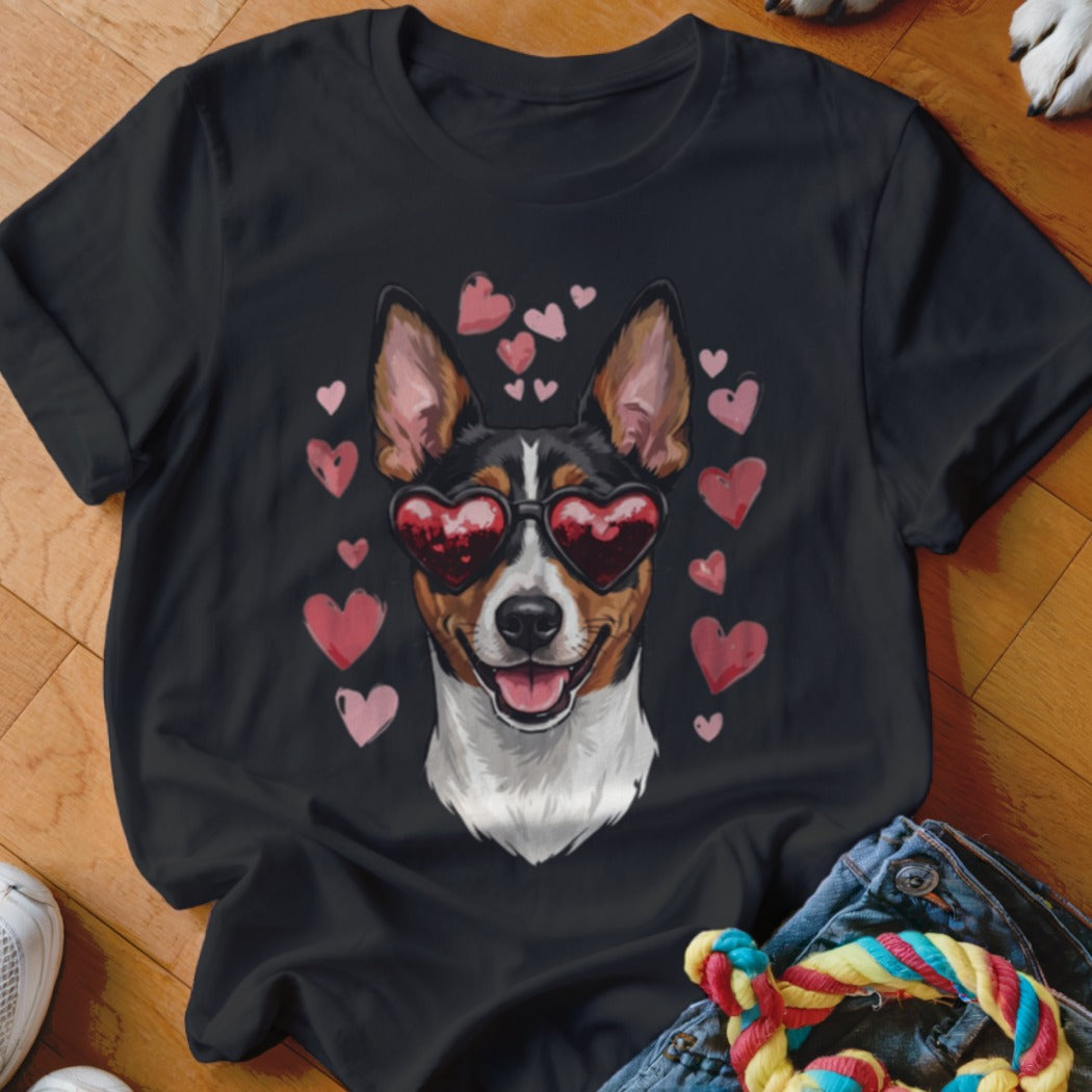 A black t-shirt features a graphic of a Basenji dog wearing heart-shaped sunglasses surrounded by pink hearts.