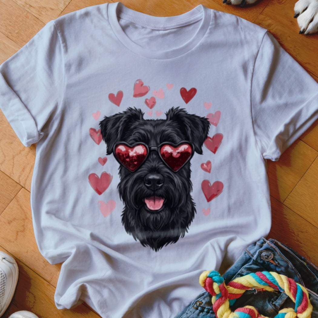 A white t-shirt featuring a graphic of a black schnauzer wearing heart-shaped sunglasses surrounded by pink hearts.