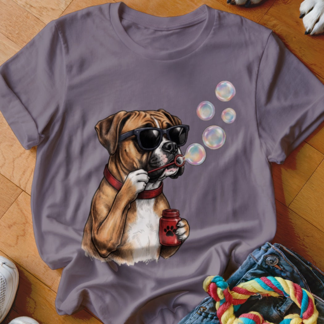 A grey crew-neck t-shirt featuring a cartoon graphic of a boxer dog wearing sunglasses and blowing bubbles.