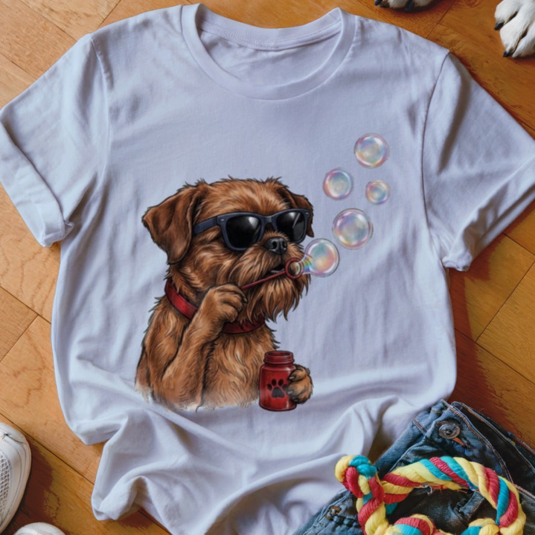A white t-shirt featuring a graphic of a brown dog wearing sunglasses and blowing bubbles.