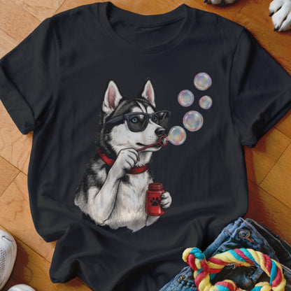 A black t-shirt printed with a graphic of a husky wearing sunglasses and blowing bubbles.