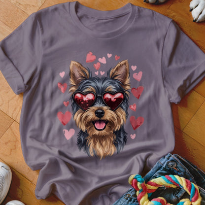 A grey short-sleeved t-shirt featuring a Yorkie wearing heart sunglasses surrounded by floating pink hearts.