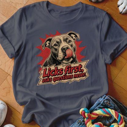 T-shirt with a pit bull licking its nose and the text "Licks first, asks questions never."