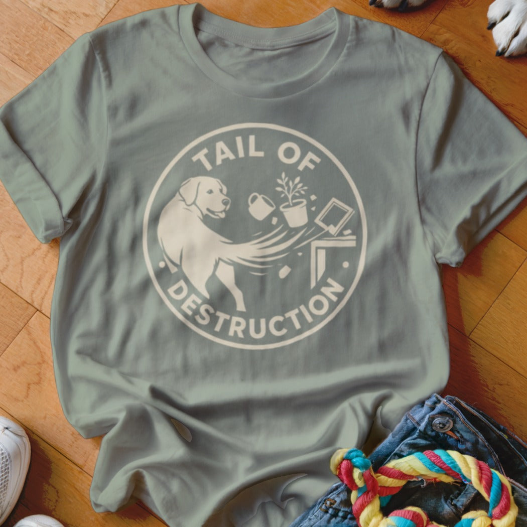 Green t-shirt with a circular graphic of a dog and text reading "TAIL OF DESTRUCTION".