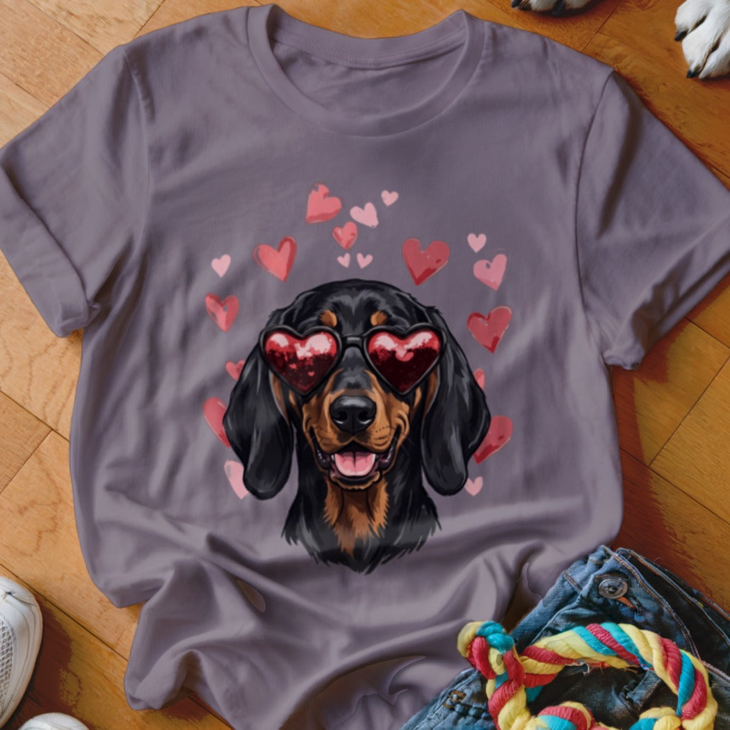 Gray t-shirt featuring an illustration of a black and tan dachshund wearing heart-shaped sunglasses surrounded by pink hearts.