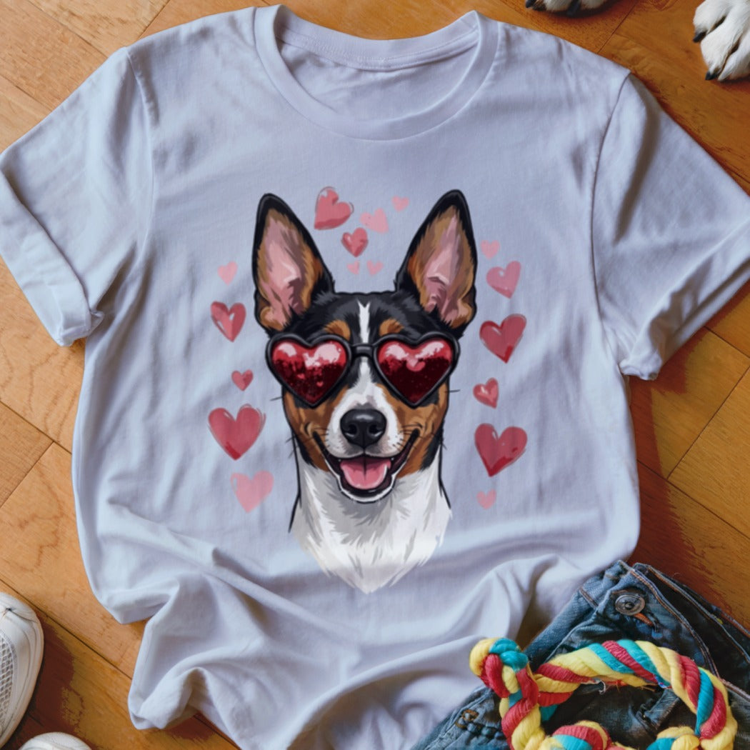 A white t-shirt featuring a graphic of a dog wearing heart-shaped sunglasses surrounded by pink hearts.