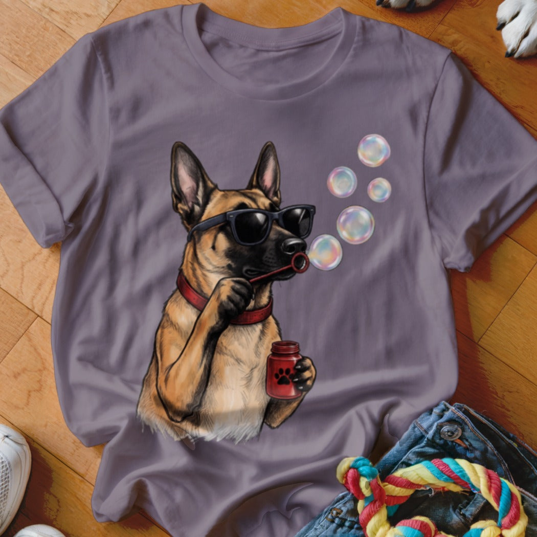 A purple t-shirt features a graphic of a German Shepherd wearing sunglasses and blowing bubbles.