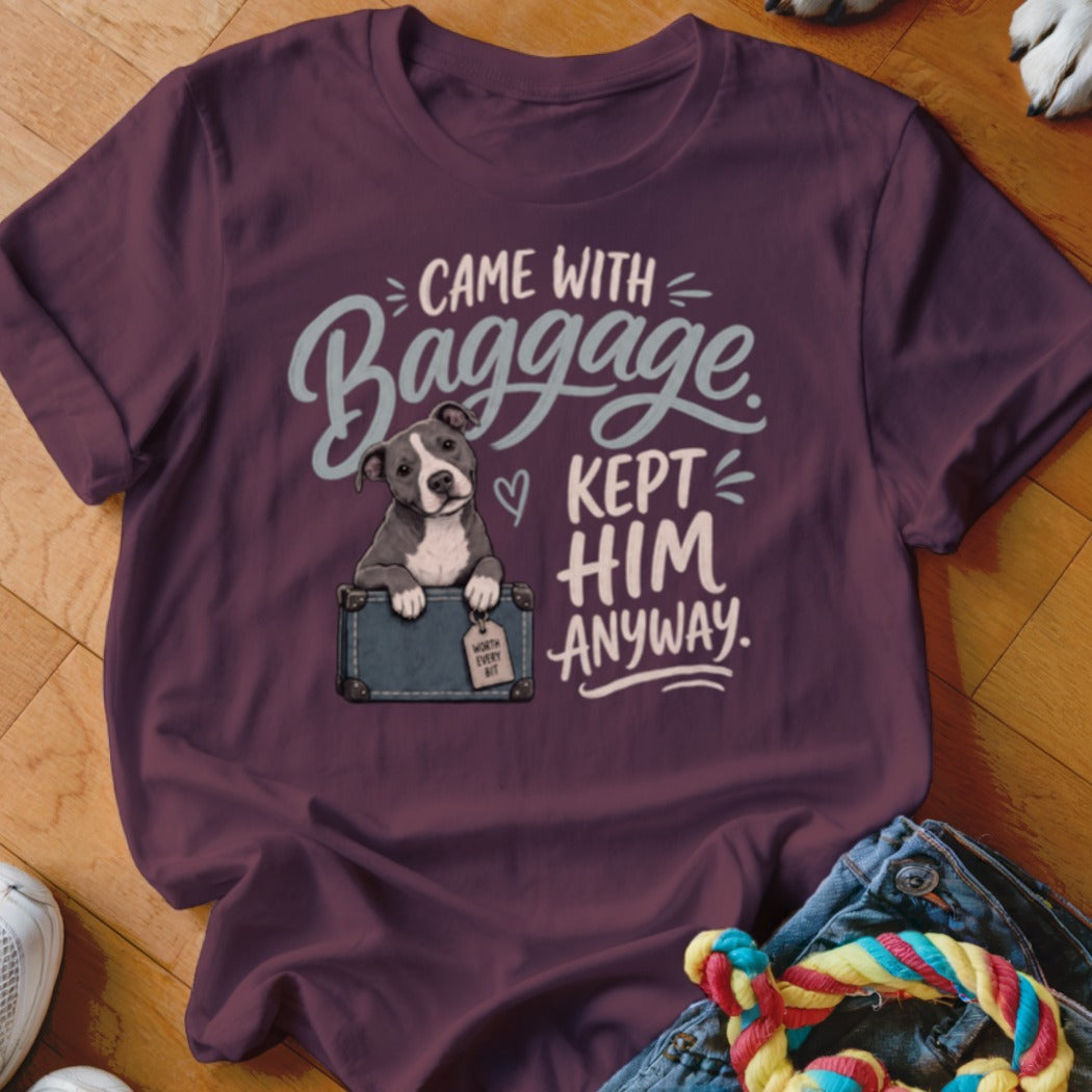 Staffordshire bull terrier in a suitcase with text "CAME WITH BAGGAGE KEPT HIM ANYWAY."