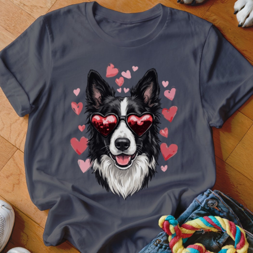 Dark grey t-shirt featuring a graphic of a black and white dog wearing heart-shaped sunglasses surrounded by pink hearts.