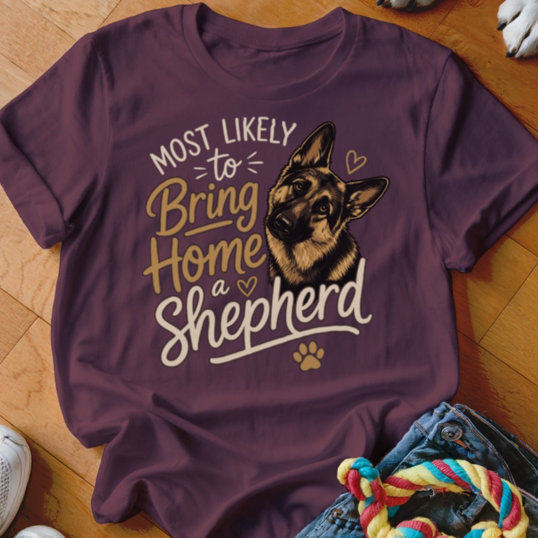 T-shirt with a German Shepherd graphic and text "Most Likely to Bring Home a Shepherd".