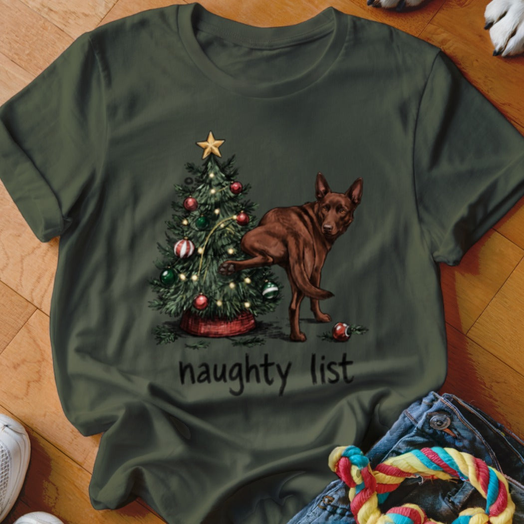 Brown dog at Christmas tree with "naughty list" text.