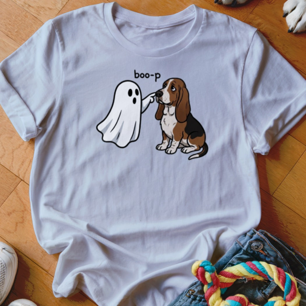 White t-shirt graphic of a ghost booping a sad-faced basset hound.