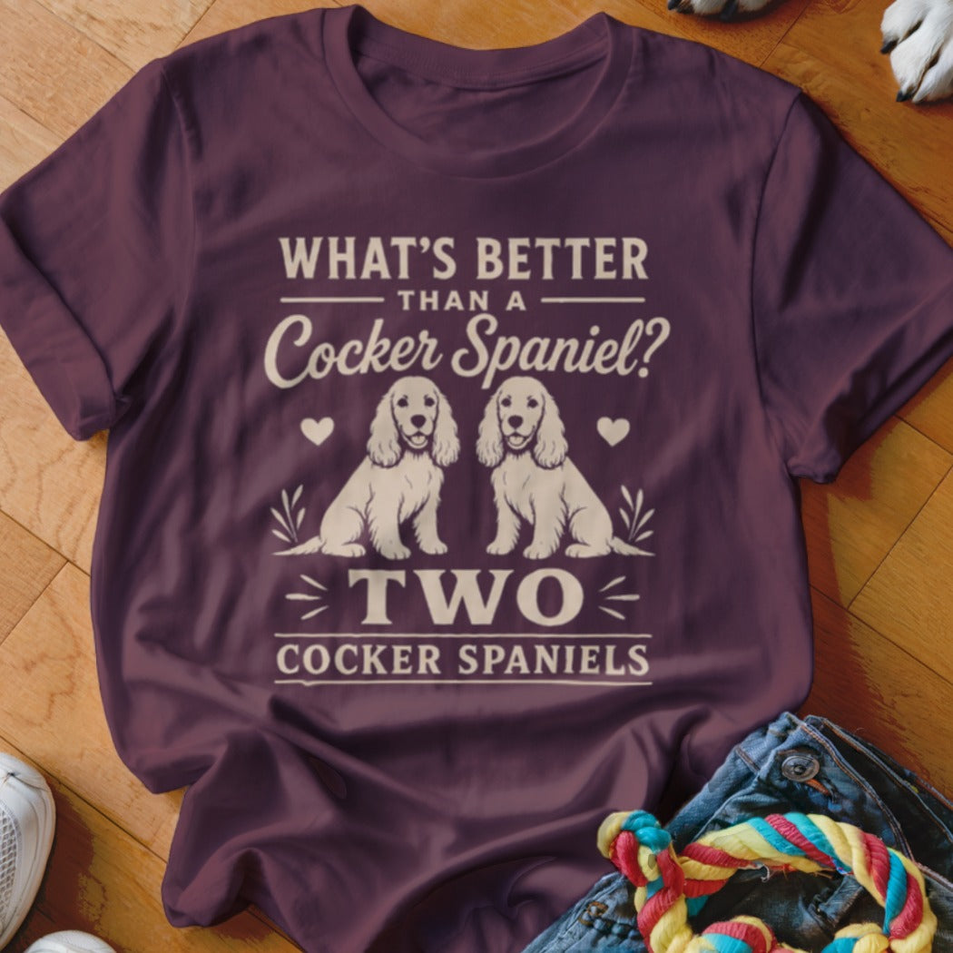 Maroon t-shirt with "What's Better Than a Cocker Spaniel? Two Cocker Spaniels" text and two dog illustrations.