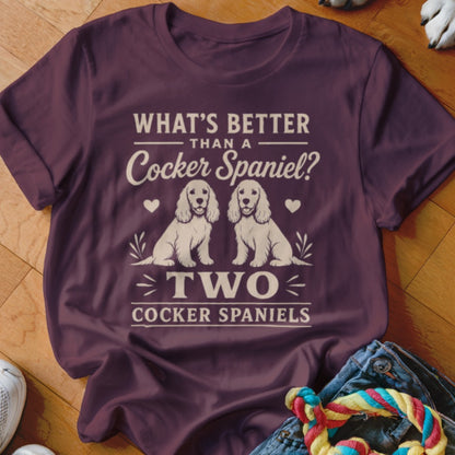Maroon t-shirt with "What's Better Than a Cocker Spaniel? Two Cocker Spaniels" text and two dog illustrations.