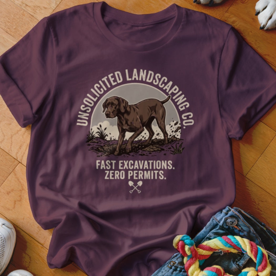 Maroon t-shirt graphic: dog in dirt, text "Unsolicited Landscaping Co." and "Fast Excavations. Zero Permits."