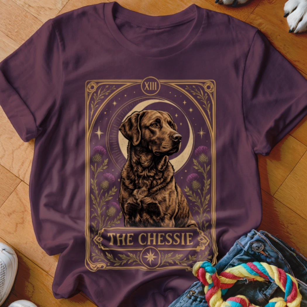 Maroon crewneck t-shirt featuring a tarot card graphic of a Chesapeake Bay Retriever with text reading The Chessie.