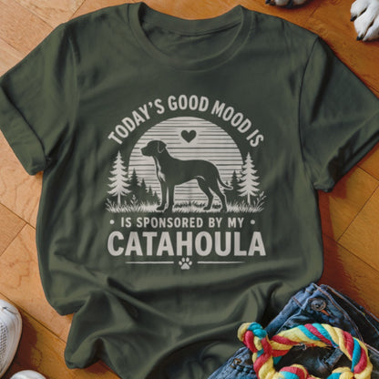 Dark green t-shirt featuring text and a Catahoula dog silhouette in a forest scene.