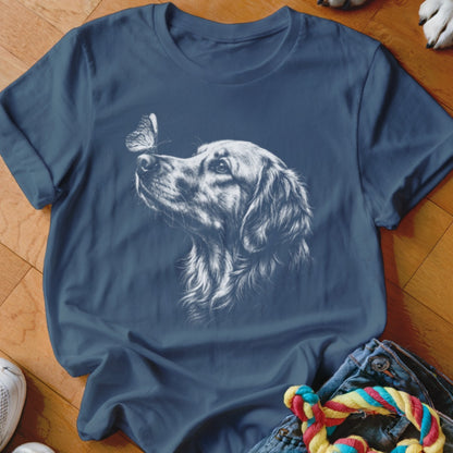 A blue t-shirt featuring a white line drawing of a golden retriever looking at a butterfly.