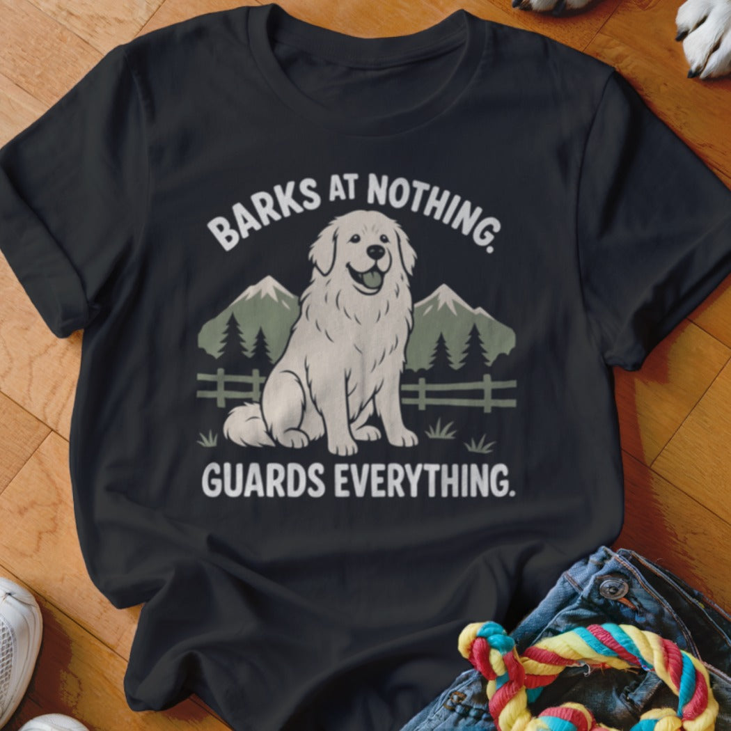 Black t-shirt with a white dog graphic and text: "BARKS AT NOTHING. GUARDS EVERYTHING."