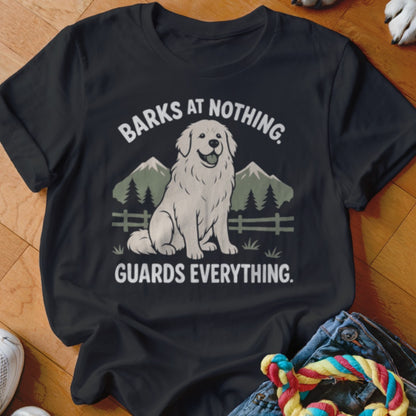 Black t-shirt with a white dog graphic and text: "BARKS AT NOTHING. GUARDS EVERYTHING."