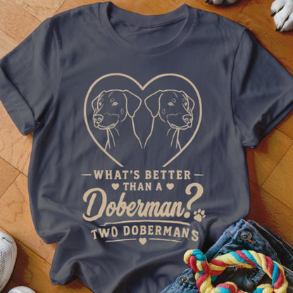 Dark t-shirt with two Dobermans in a heart and text "What's better than a Doberman? Two Dobermans".