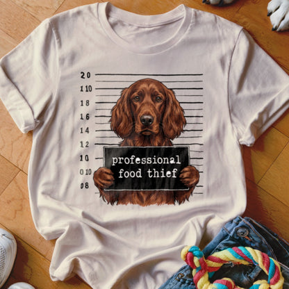 Irish Setter mugshot with "professional food thief" sign.