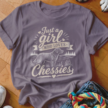 Purple t-shirt with "Just a girl who loves Chessies" and a dog graphic.
