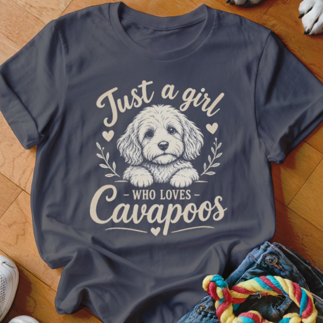 Dark grey t-shirt with white graphic of a Cavapoo and text "Just a girl who loves Cavapoos".