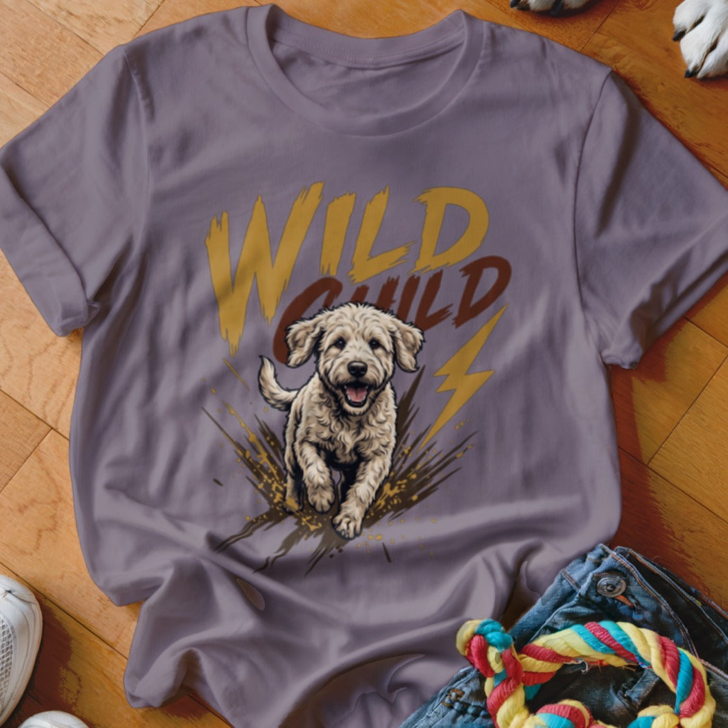 A purple crewneck t-shirt featuring a graphic of a running puppy and the text Wild Child.