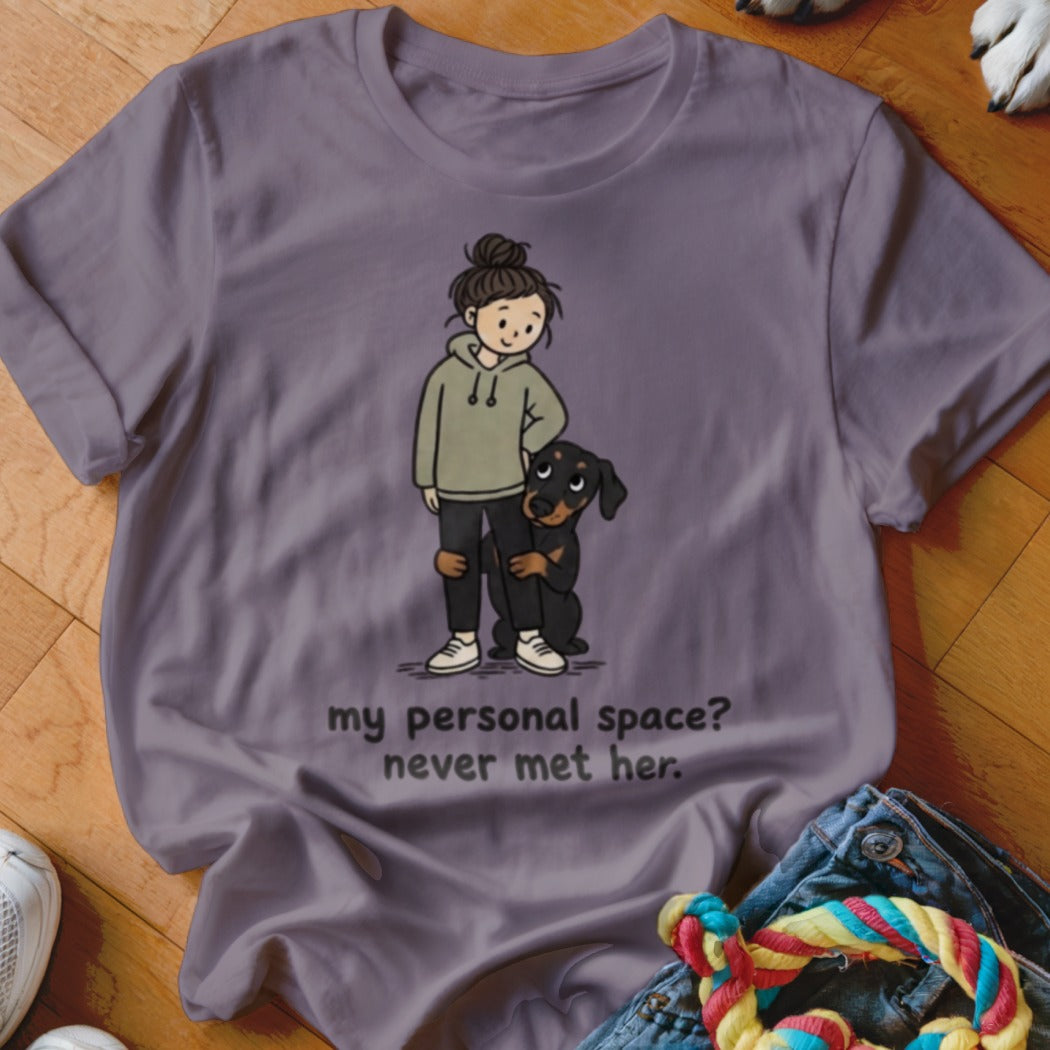 Illustration of a girl and her dog on a purple t-shirt with text.