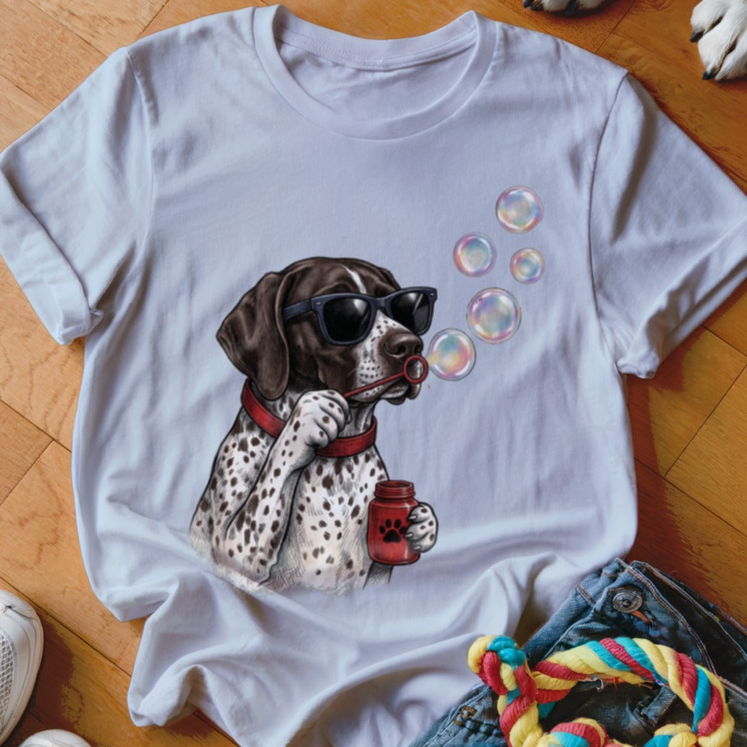 White t-shirt featuring a graphic of a spotted dog wearing sunglasses and blowing bubbles.