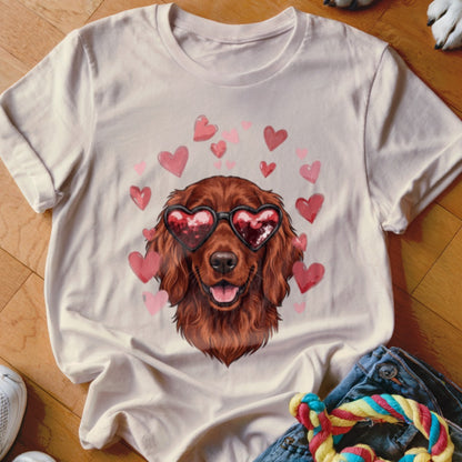 Light beige t-shirt featuring a graphic of a brown dog wearing heart-shaped sunglasses surrounded by pink hearts.