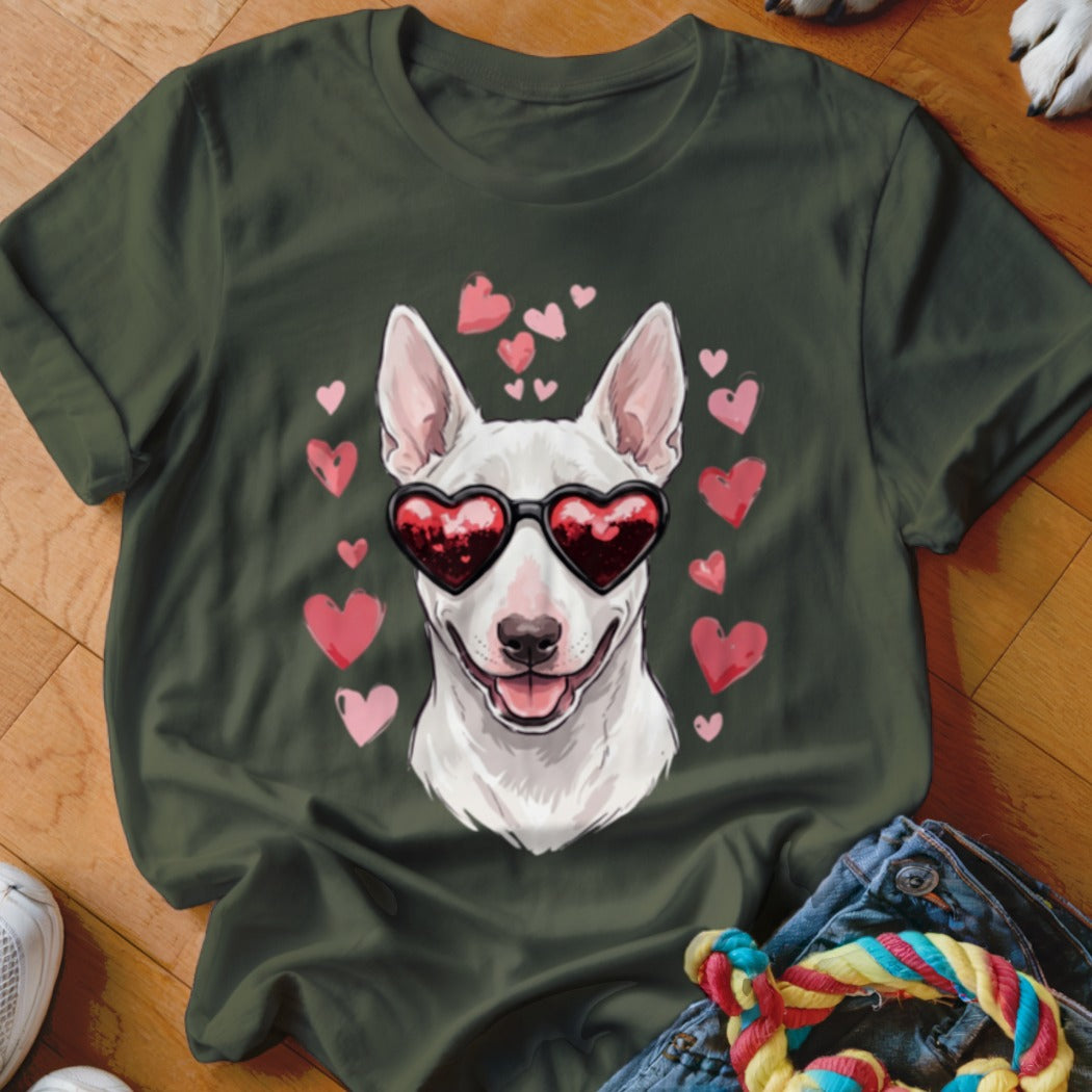 Dark green t-shirt featuring a graphic of a white dog wearing heart-shaped sunglasses surrounded by floating pink hearts.