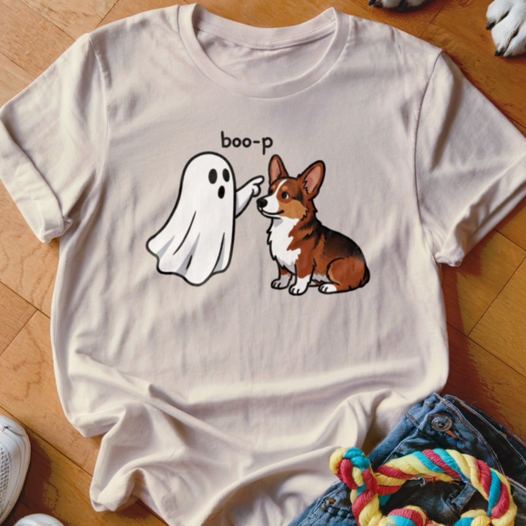 Light beige t-shirt with a cartoon ghost booping a corgi dog.